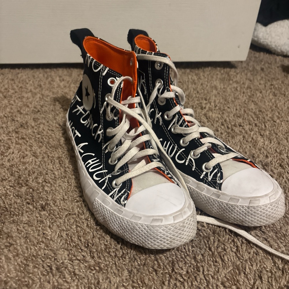 Converse Black and White High-Tops with Orange Lining